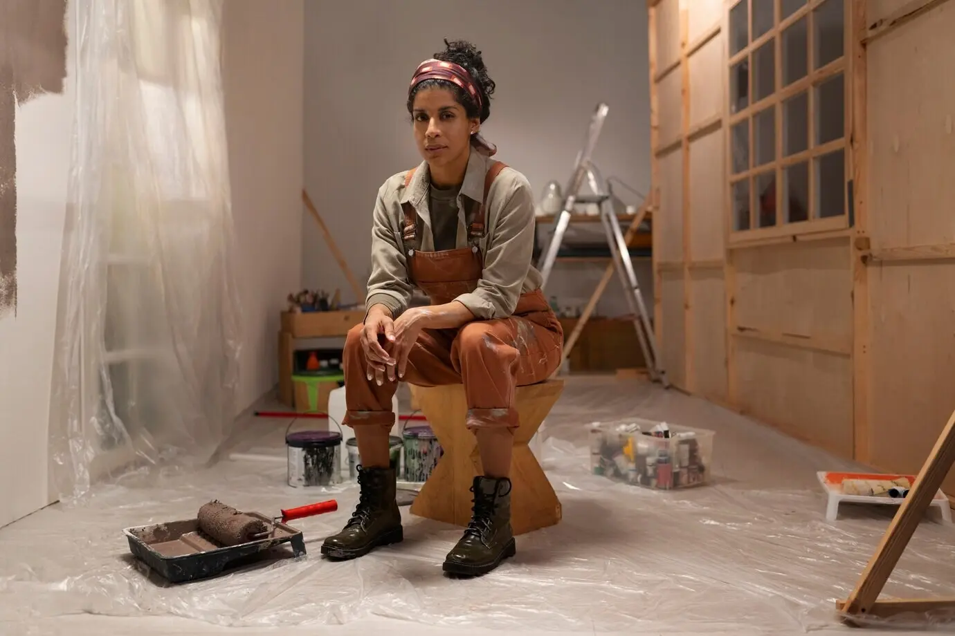 Full-body shot of a woman sitting indoors